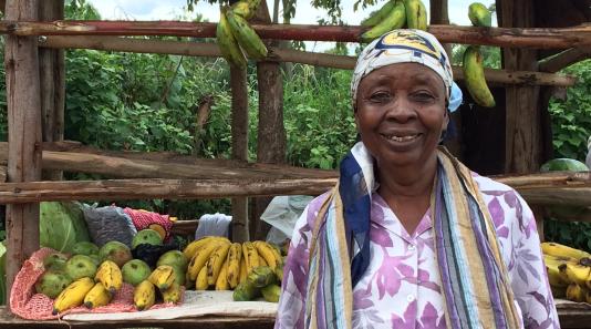 Woman at her fruit stand in Kenya