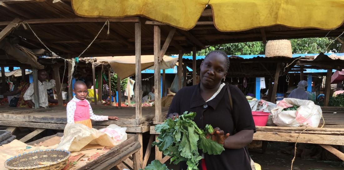 A member of JFWG selling vegetables in the market.